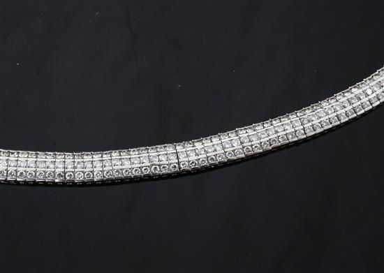 A late 20th century white gold and diamond encrusted bracelet, approx. 7.25in.